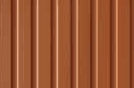 Powder coated orange fluted panels made specially for the client's needs